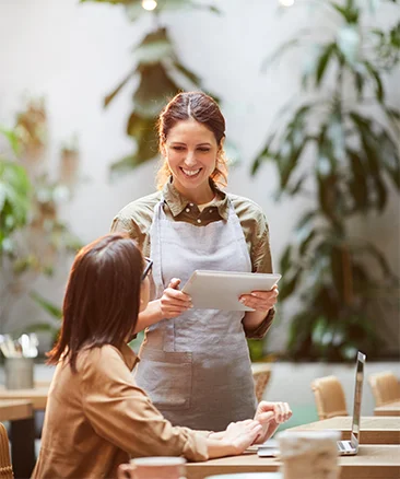 waitress taking order through wireless restaurant pos