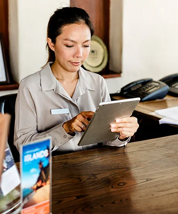 receptionist using ipad based visitor management system