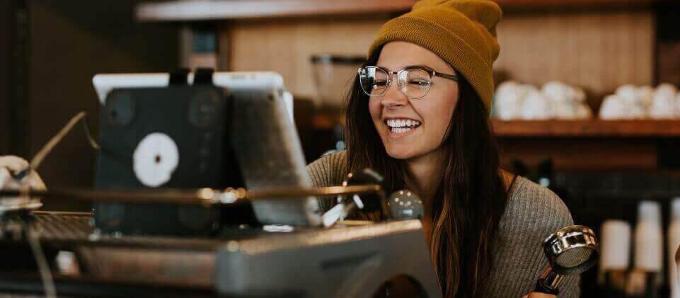 Restaurant cashier using POS system